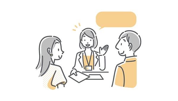 スタッフの説明を受ける男女のイラスト